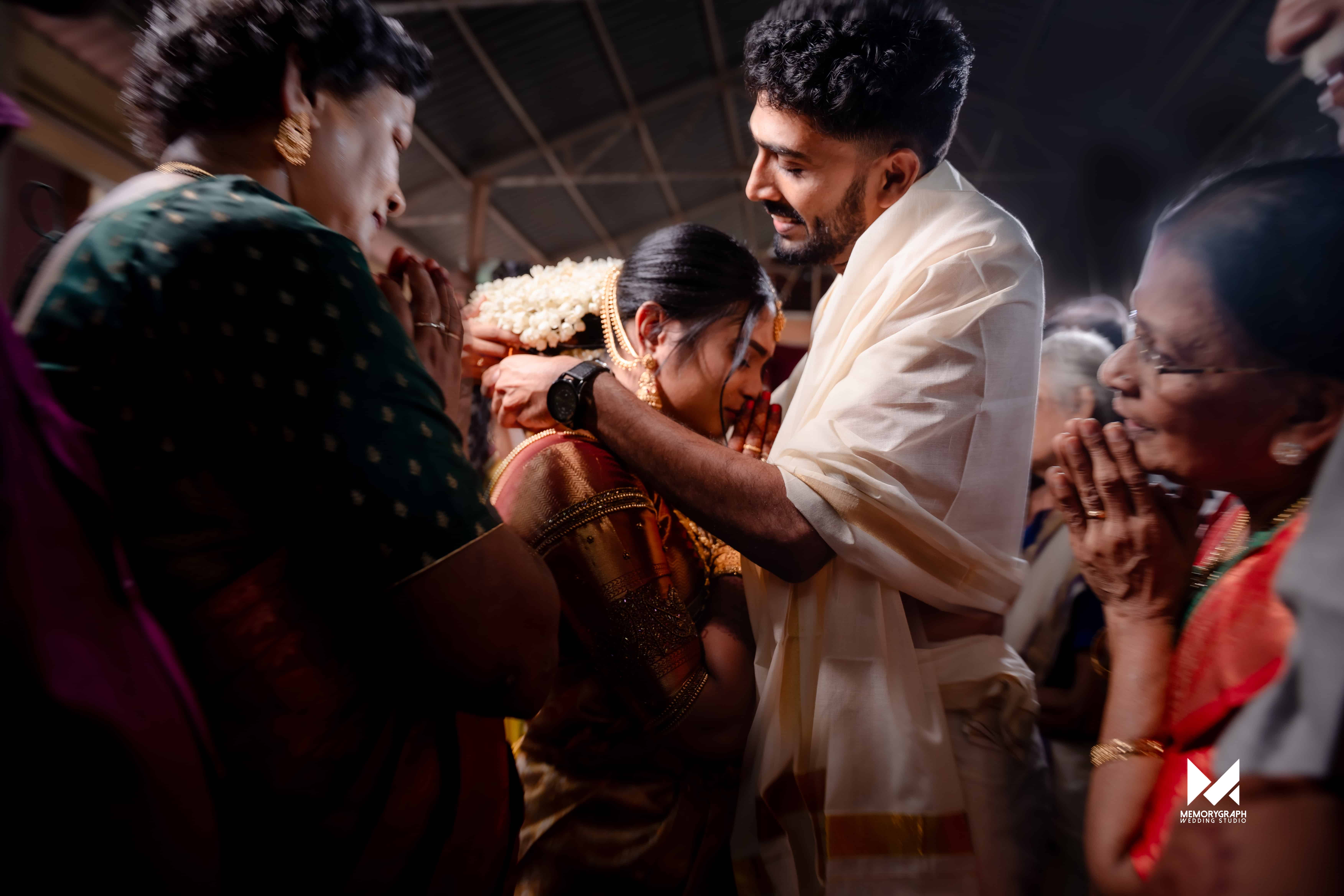 Emotional candid wedding moment between the couple and family